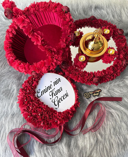 There are a henna basket, henna tray, henna tambourine with gold dome and text and 4 led candles.