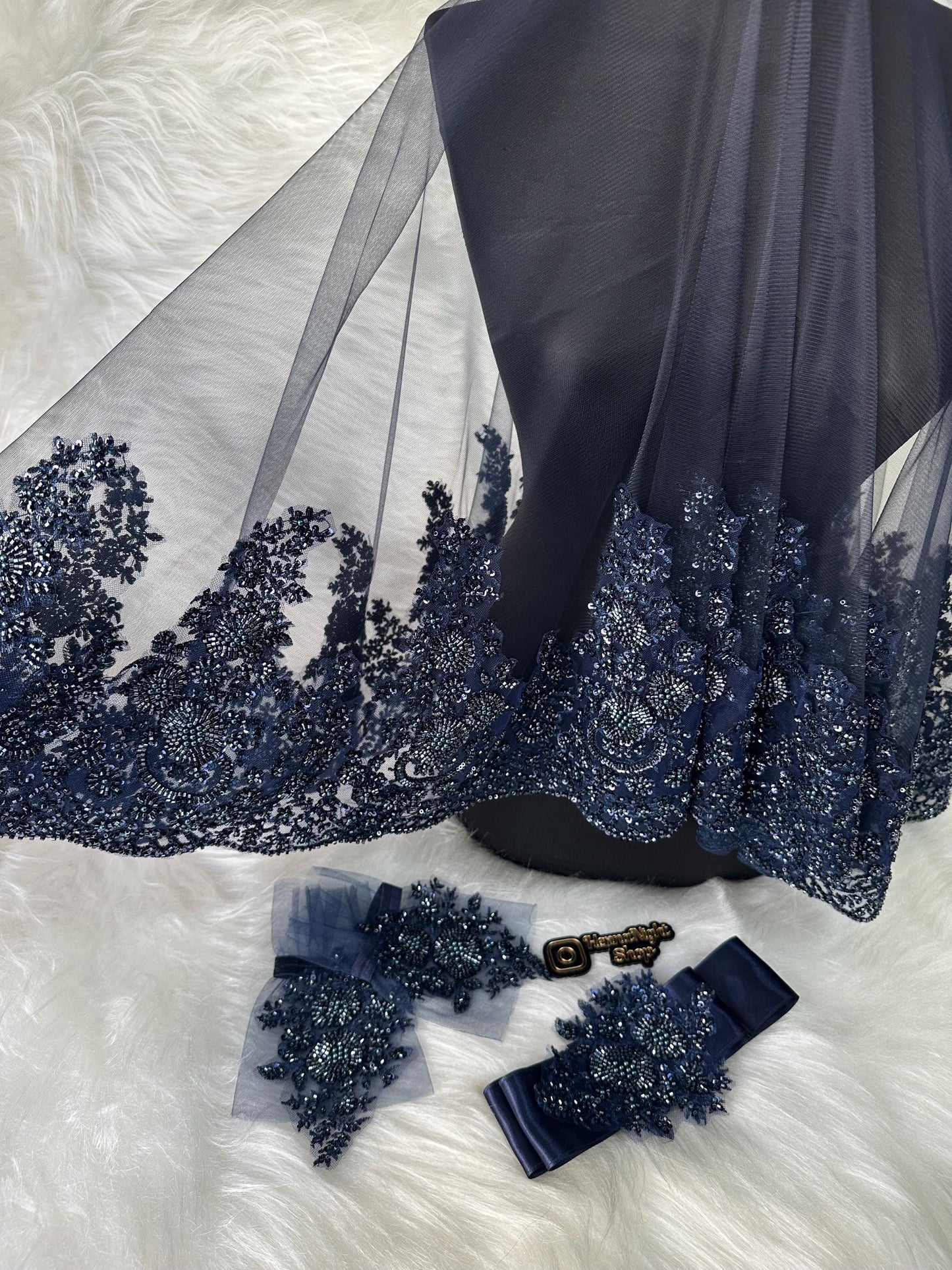 charming dark blue henna veil gloves and belt with beaded patterns on them.