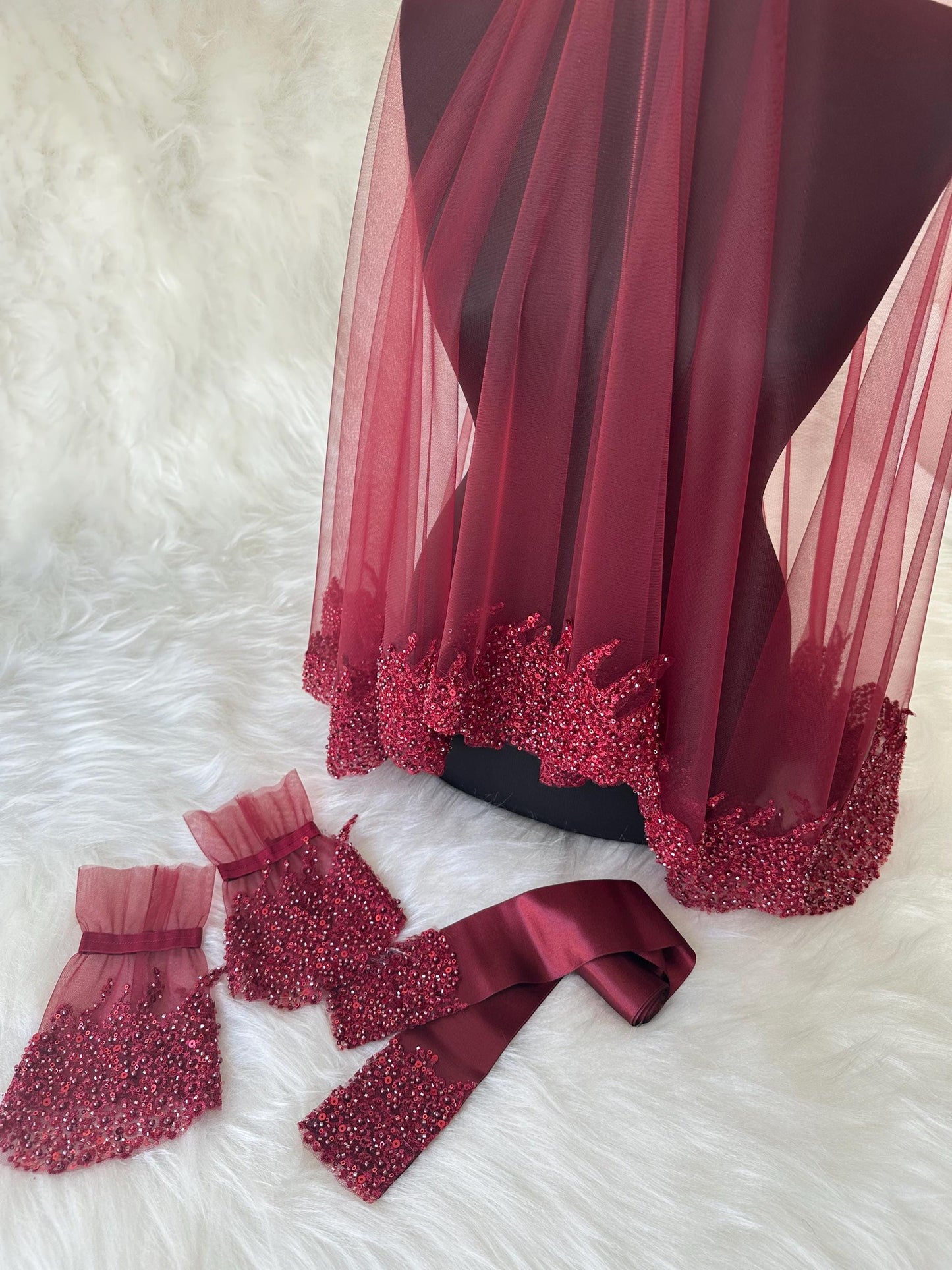 Burgundy bridal veil with beaded trim, matching beaded sash and wrist cuffs.