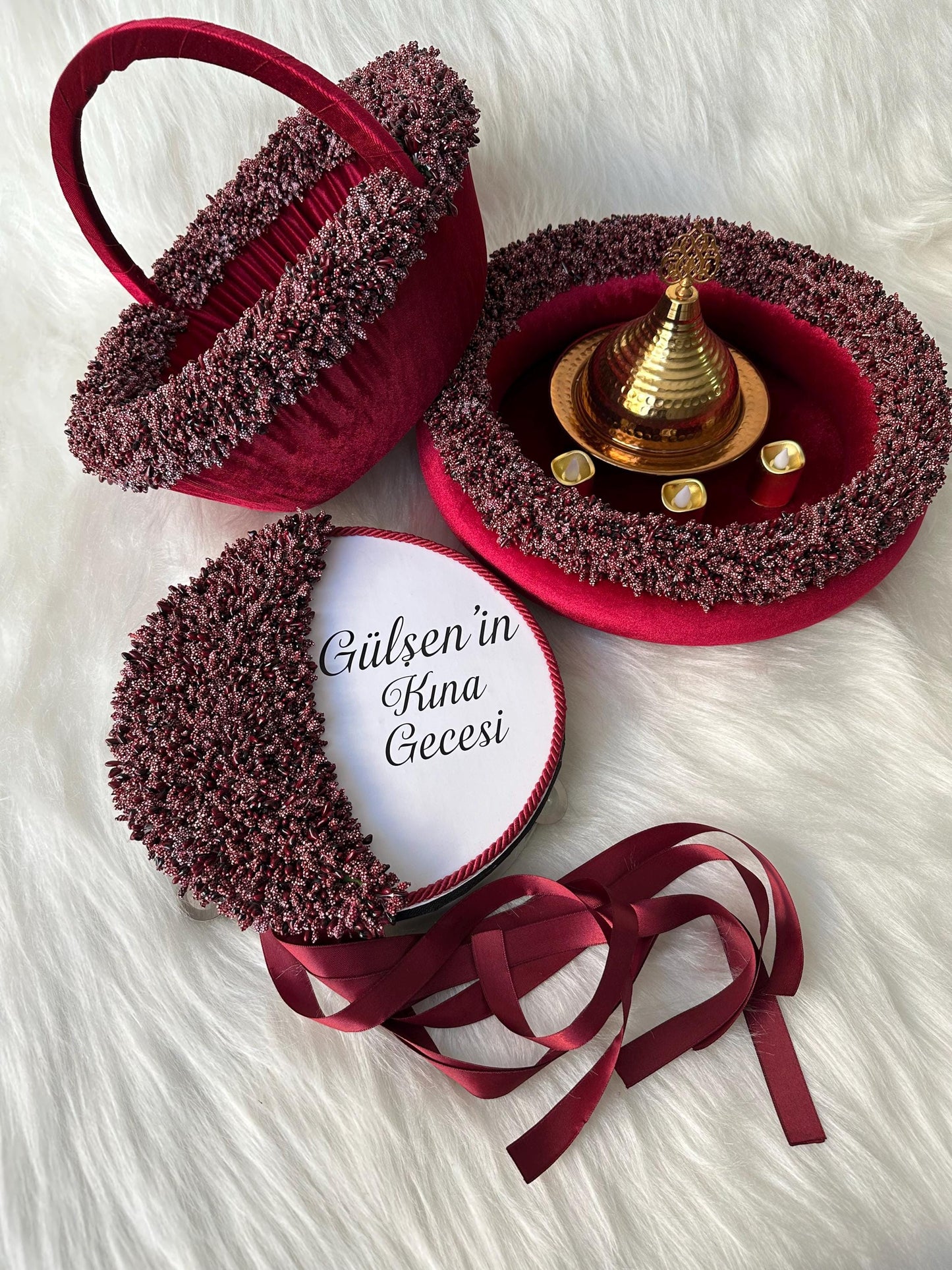 a gold dome with hand candles. burgundy henna basket, personalized red henna tambourine, red henna tray