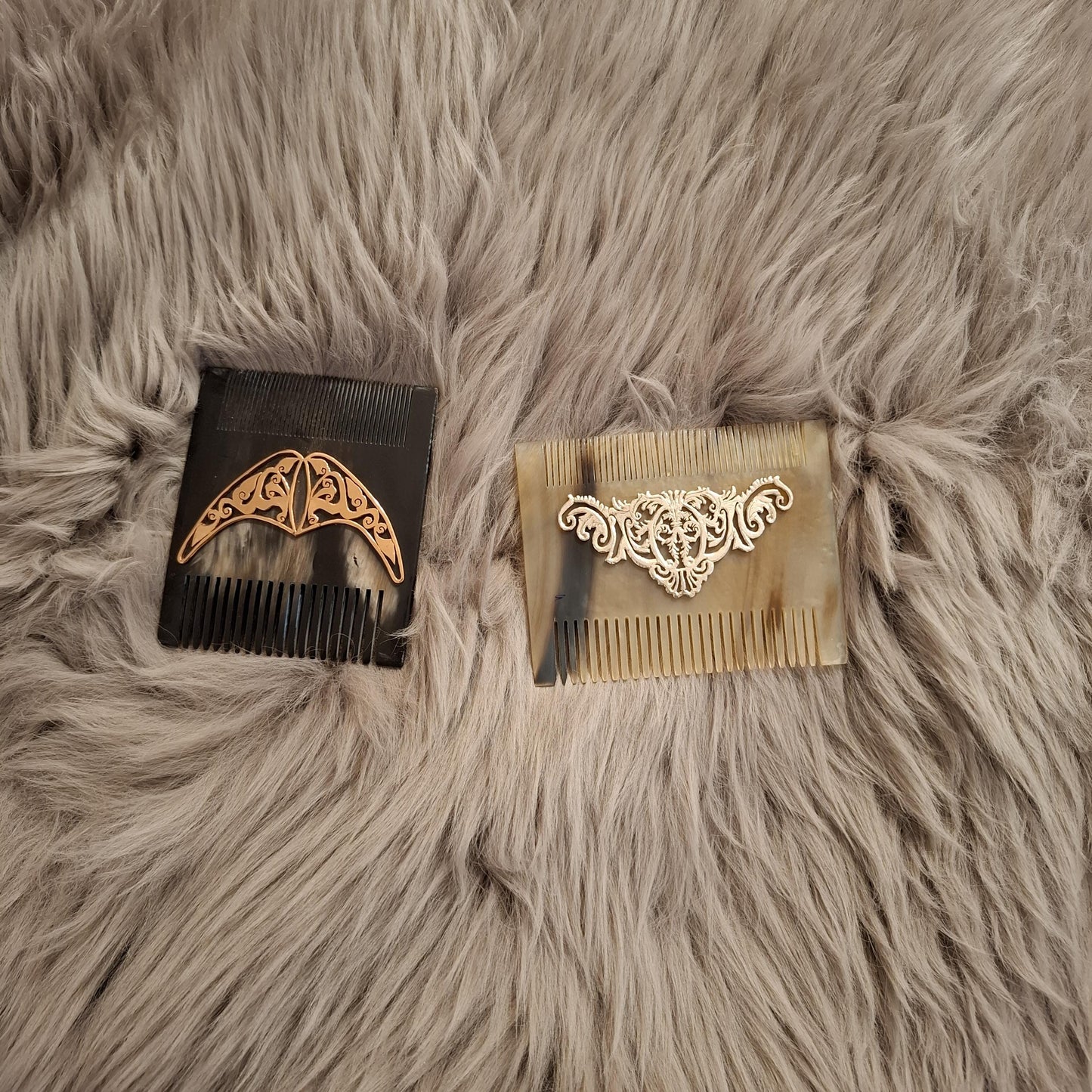 Natural light brown comb from front side. It is over brown fur carpet and black one is square and beige one rectangle