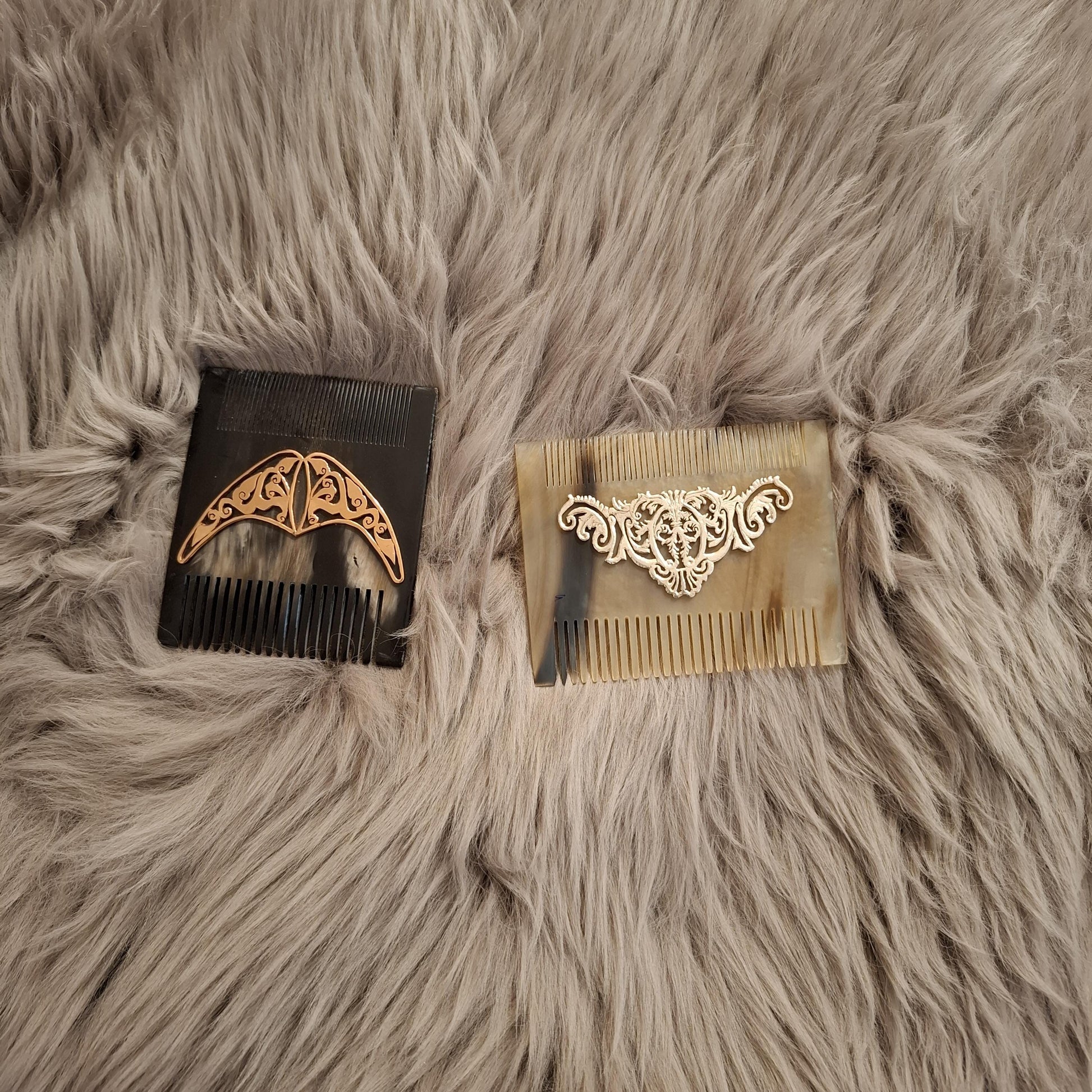 Natural light brown comb from front side. It is over brown fur carpet and black one is square and beige one rectangle