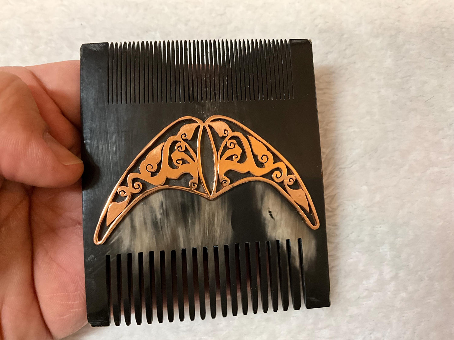 black buffalo horn front side with golden iron design